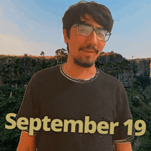 a man wearing glasses and a black shirt that says september 19 on it