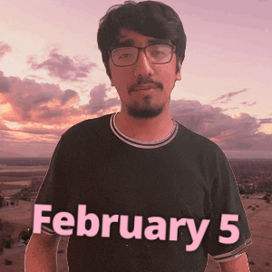 A Man Wearing Glasses And A Black Shirt With February 5 Written On It GIF