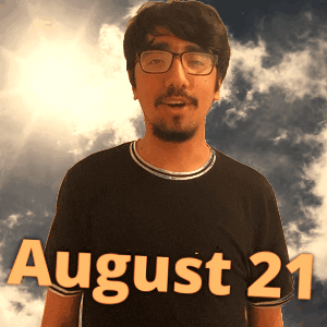 A Man Wearing Glasses And A Black Shirt With The Date August 21 On It GIF