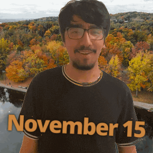 A Man Wearing Glasses And A Black Shirt With The Date November 15 On It GIF