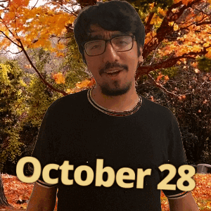 A Man Wearing Glasses And A Black Shirt With The Date October 28 On The Bottom GIF