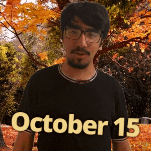 A Man Wearing Glasses And A Black Shirt With The Date Of October 15 GIF