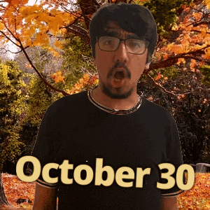 A Man Wearing Glasses And A Black Shirt With The Date Of October 30 GIF