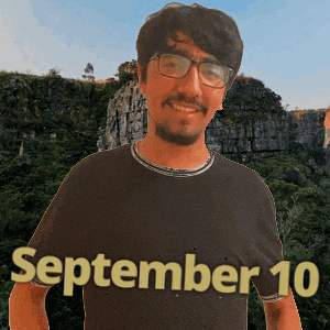 a man wearing glasses and a black shirt with the date september 10