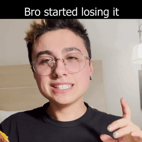 A Man Wearing Glasses And A Black Shirt With The Words Bro Started Losing It On The Bottom GIF
