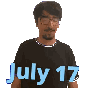 a man wearing glasses and a black shirt with the words july 17 on it