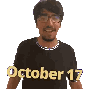 a man wearing glasses and a black shirt with the words october 17 on it