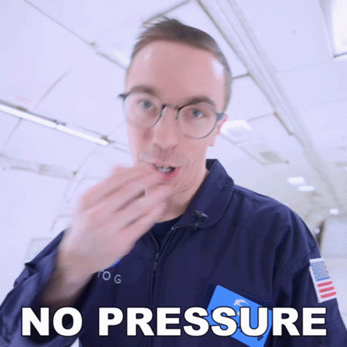 A Man Wearing Glasses And A Blue Jacket Says " No Pressure " GIF