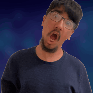 A Man Wearing Glasses And A Blue Shirt Is Making A Funny Face GIF