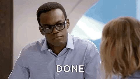 A Man Wearing Glasses And A Blue Shirt Is Talking To A Woman And Saying `` Done '' . GIF