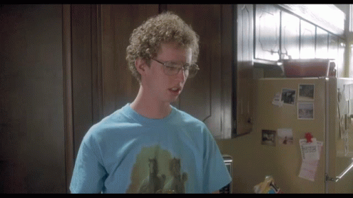 A Man Wearing Glasses And A Blue T-Shirt With A Picture Of Horses On It GIF