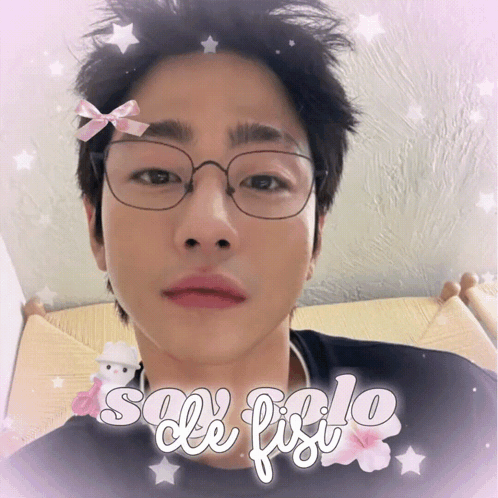 A Man Wearing Glasses And A Bow On His Forehead Is Surrounded By The Words Sole Fiolo GIF