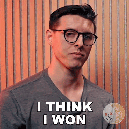 A Man Wearing Glasses And A Gray Shirt Says I Think I Won GIF