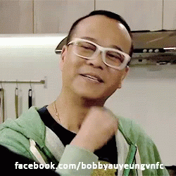 A Man Wearing Glasses And A Green Hoodie With Facebook.com/bobbyauyeungvnfc Written Below Him GIF