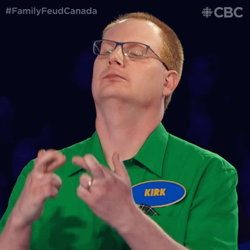 A Man Wearing Glasses And A Green Shirt Has A Name Tag That Says Kirk GIF