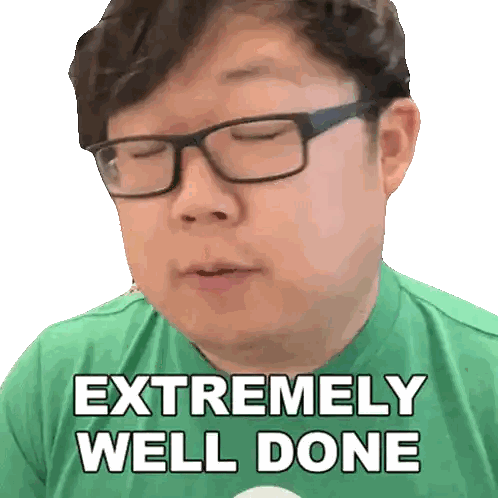 a man wearing glasses and a green shirt that says extremely well done