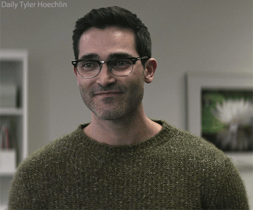A Man Wearing Glasses And A Green Sweater Has The Name Daily Tyler Hoechlin Written Above Him GIF