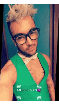 a man wearing glasses and a green vest has the name meeks-man on the bottom