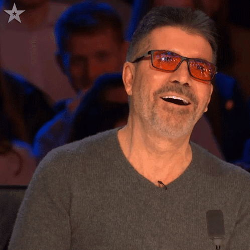 Man With Glasses And Grey Sweater Laughing GIF