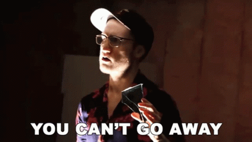 A Man Wearing Glasses And A Hat Is Holding A Piece Of Glass And Says You Can 'T Go Away GIF