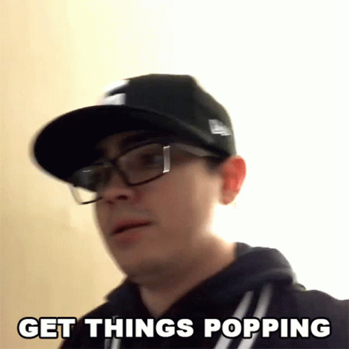 A Man Wearing Glasses And A Hat Is Saying Get Things Popping GIF