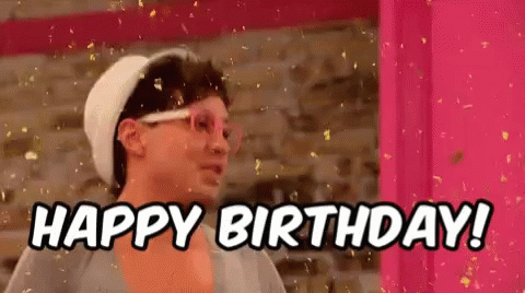 A Man Wearing Glasses And A Hat Is Saying `` Happy Birthday '' . GIF