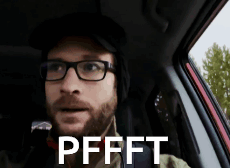 A Man Wearing Glasses And A Hat Is Sitting In A Car With The Words Pffft Written On His Face GIF