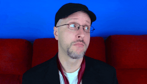 A Man Wearing Glasses And A Hat Looks Up At Something GIF