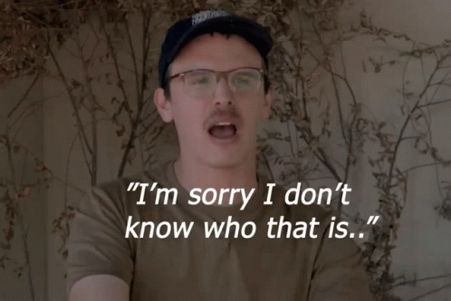 A Man Wearing Glasses And A Hat Says I 'M Sorry I Don 'T Know Who That Is GIF