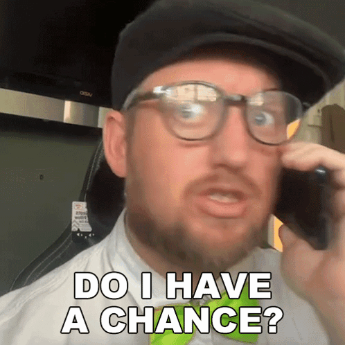 A Man Wearing Glasses And A Hat Talking On A Cell Phone With The Words Do I Have A Chance Below Him GIF