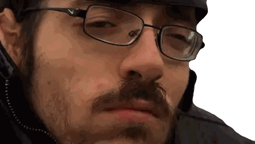 a man wearing glasses and a hat with the nike logo