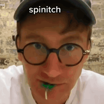 A Man Wearing Glasses And A Hat With The Word Spinitch On His Face GIF