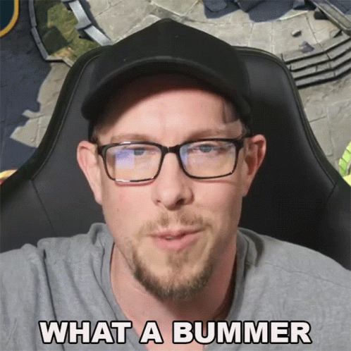 A Man Wearing Glasses And A Hat With The Words What A Bummer Below Him GIF