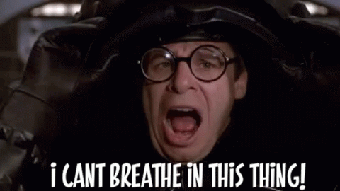 A Man Wearing Glasses And A Helmet Is Saying `` I Cant Breathe In This Thing ! '' GIF