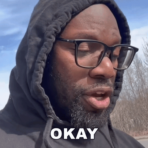 A Man Wearing Glasses And A Hoodie Says " Okay " GIF