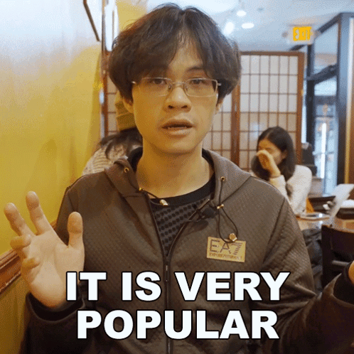 A Man Wearing Glasses And A Jacket That Says Ea7 On It GIF