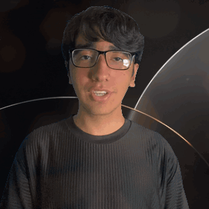 A Man Wearing Glasses And A Kane Shirt Looks At The Camera GIF