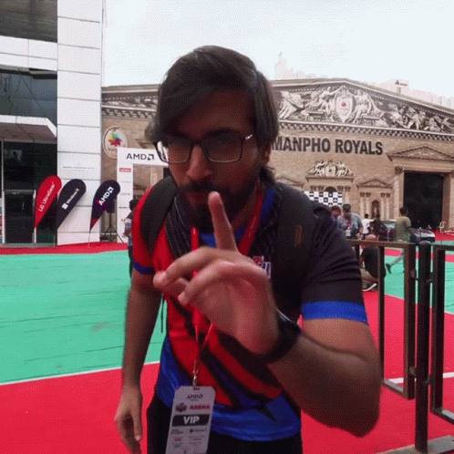 A Man Wearing Glasses And A Lanyard That Says Amd Vip GIF