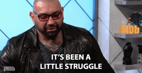 A Man Wearing Glasses And A Leather Jacket Says " It 'S Been A Little Struggle " GIF
