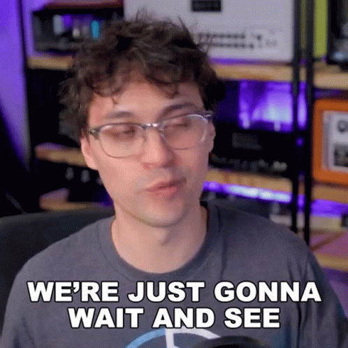A Man Wearing Glasses And A Mercedes Shirt Says We 'Re Just Gonna Wait And See GIF