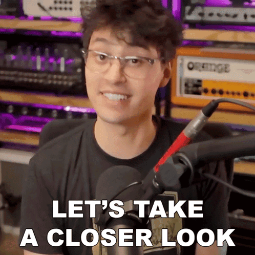 A Man Wearing Glasses And A Microphone Says " Let 'S Take A Closer Look " GIF