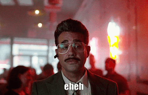 A Man Wearing Glasses And A Mustache Says Eh GIF