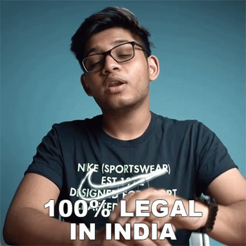 A Man Wearing Glasses And A Nike Sportswear T-Shirt Says That 100 % Of Legal In India GIF