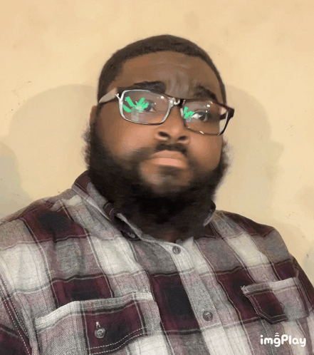 A Man Wearing Glasses And A Plaid Shirt Has The Word Imgplay At The Bottom Of His Image GIF