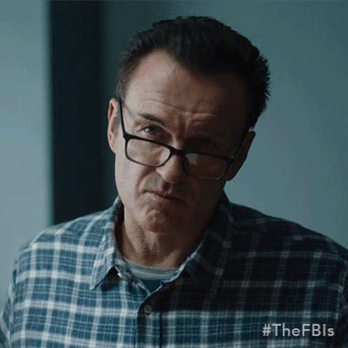 A Man Wearing Glasses And A Plaid Shirt Has #Thefbls Written On The Bottom Of His Shirt GIF
