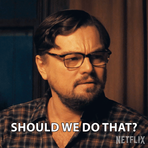 A Man Wearing Glasses And A Plaid Shirt Says " Should We Do That " GIF