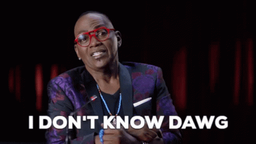 A Man Wearing Glasses And A Purple Suit Is Talking Into A Microphone And Saying `` I Don T Know Dawg '' GIF