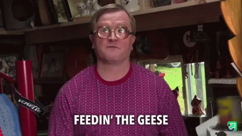 A Man Wearing Glasses And A Purple Sweater Says Feedin ' The Geese GIF