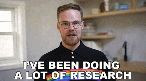 A Man Wearing Glasses And A Rainbow Shirt Says " I 'Ve Been Doing A Lot Of Research " GIF