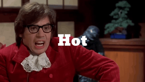 A Man Wearing Glasses And A Red Jacket Has The Word Hot Written Above Him GIF